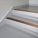Bronze Aluminium insert in a 66x55mm square front aluminium stair nosing with 13mm Polar Grey riser highlight, fitted to interior steps