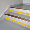 Bronze Aluminium insert in a 66x55mm square front aluminium stair nosing with 13mm Yellow riser highlight, fitted to interior steps