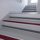 Claret Castellated insert in a cut to size 66x55mm aluminium stair nosing with 13mm Light Grey riser highlight, fitted to interior steps