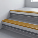 Gold Castellated insert in a 66x55mm square front aluminium stair nosing with 13mm Light Grey riser highlight, fitted to interior steps