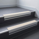 Ivory Castellated insert in a cut to size 66x55mm aluminium stair nosing with 13mm Light Grey riser highlight, fitted to interior steps