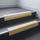 Ivory Castellated insert in a cut to size 66x55mm aluminium stair nosing with 13mm Yellow riser highlight, fitted to interior steps