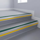 Jade Castellated insert in a 66x55mm square front aluminium stair nosing with 13mm Yellow riser highlight, fitted to interior steps