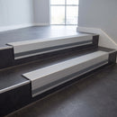 Light Grey Castellated insert in a 66x55mm square front aluminium stair nosing with 13mm Light Grey riser highlight, fitted to interior steps