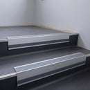 Light Grey Smooth Textured insert in a 66x55mm square front aluminium stair nosing with 13mm Light Grey riser highlight, fitted to interior steps