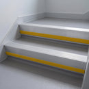 Mill Aluminium insert in a cut to size 66x55mm aluminium stair nosing with 13mm Yellow riser highlight, fitted to interior steps