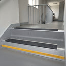 Nimbus Castellated insert in a cut to size 66x55mm aluminium stair nosing with 13mm Yellow riser highlight, fitted to interior steps