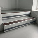 Peat Castellated insert in a cut to size 66x55mm aluminium stair nosing with 13mm Light Grey riser highlight, fitted to interior steps