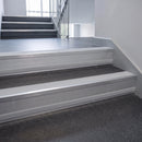 Polar Grey Castellated insert in a 66x55mm square front aluminium stair nosing with 13mm Polar Grey riser highlight, fitted to interior steps
