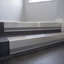 Polished Aluminium insert in a 66x55mm square front aluminium stair nosing with 13mm Light Grey riser highlight, fitted to interior steps