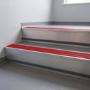 Poppy Castellated insert in a cut to size 66x55mm aluminium stair nosing with 13mm Light Grey riser highlight, fitted to interior steps