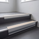 Porth Stone Smooth Textured insert in a 66x55mm square front aluminium stair nosing with 13mm Light Grey riser highlight, fitted to interior steps