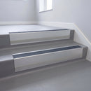Regency Castellated insert in a 66x55mm square front aluminium stair nosing with 13mm Polar Grey riser highlight, fitted to interior steps