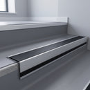 Black Smooth Textured insert in a 66x55mm square front aluminium stair nosing with 13mm black riser highlight, fitted to interior steps