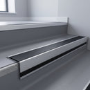 Black Smooth Textured insert in a cut to size 66x55mm aluminium stair nosing with 13mm black riser highlight, fitted to interior steps