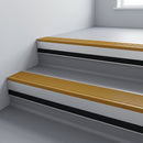 Gold Castellated insert in a cut to size 66x55mm aluminium stair nosing with 13mm black riser highlight, fitted to interior steps