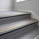 Light Bronze Aluminium insert in a cut to size 66x55mm aluminium stair nosing with 13mm black riser highlight, fitted to interior steps