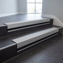 Light Grey Castellated insert in a cut to size 66x55mm aluminium stair nosing with 13mm black riser highlight, fitted to interior steps