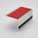 Cut to size aluminium stair nosing 66x55mm on a studio background, showing the 66mm tread plate with red castellated insert, square front edge and black 13mm riser highlight band