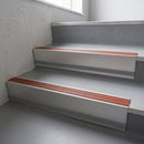 Rustic Castellated insert in a 66x55mm square front aluminium stair nosing with 13mm Light Grey riser highlight, fitted to interior steps
