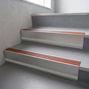 Rustic Castellated insert in a 66x55mm square front aluminium stair nosing with 13mm Polar Grey riser highlight, fitted to interior steps