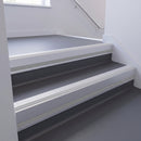 Satin Aluminium insert in a 66x55mm square front aluminium stair nosing with 13mm Polar Grey riser highlight, fitted to interior steps