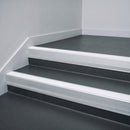 White Castellated insert in a 66x55mm square front aluminium stair nosing with 13mm Polar Grey riser highlight, fitted to interior steps