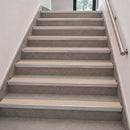 Aluminium stair nosings with beige anti-slip PVC inserts fitted along an internal tiled commercial staircase