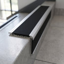 Aluminium Stair Nosing 78.5mm x 67mm Raked Back with Carborundum Insert professionally fitted in use