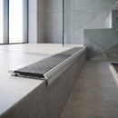 Aluminium Stair Nosing 78.5mm x 67mm Raked Back with Carborundum Insert professionally fitted in use