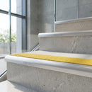 78.5x67mm aluminium stair nosing with carborundum insert fitted along a flight of steps
