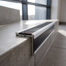 Aluminium Stair Nosing 78.6mm x 71mm Raked Back with Carborundum Insert professionally fitted in use