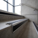 Aluminium Stair Nosing 78.6mm x 71mm Raked Back with Carborundum Insert professionally fitted in use