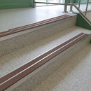 Brown twin insert 88x32mm aluminium stair nosing fitted to terrazzo school steps