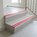 Red twin insert 88x32mm aluminium stair nosing fitted to terrazzo school steps