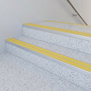 Yellow twin insert 88x32mm aluminium stair nosing fitted to terrazzo school steps