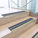 Cobalt Blue double insert 91x32mm aluminium stair nosing fitted to concrete office steps with a green photoluminescent nose strip