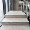Ice Grey double insert 91x32mm aluminium stair nosing fitted to concrete office steps in a glazed stairwell