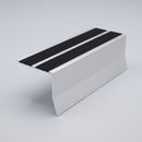 Aluminium chevron stair nosing 91x70mm, mill finish with twin premium black PVC inserts, studio view showing the kinked front face