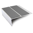 93x32mm rakeback aluminium stair nosing with twin Midnight Grey anti-slip PVC inserts across the tread