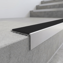 Slimline 59x30mm square back aluminium stair nosing with a black smooth textured PVC insert with no ribs, on a satin aluminium bar, fitted along the front edge of a concrete step
