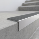 Slimline 59x30mm square back aluminium stair nosing with a light grey smooth textured PVC insert with no ribs, on a satin aluminium bar, fitted along the front edge of a concrete step