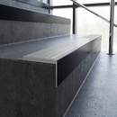 Slimline 59x30mm square back aluminium stair nosing with a pale polar grey smooth textured PVC insert with no ribs, on a black anodised bar, fitted along the front edge of a concrete step