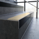 Slimline 59x30mm square back aluminium stair nosing with a pale Porth Stone smooth textured PVC insert with no ribs, on a black anodised bar, fitted along the front edge of a concrete step