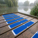 Blue grit anti-slip plates fixed across a timber angling platform on a misty fishing lake