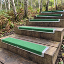 Green grit aluminium nosing plates on timber steps on a country park woodland trail