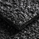 Macro close-up of the bonded aggregate grit surface and 5mm cut edge of an anti-slip GRP sheet