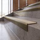 Antique Brass anti-slip stair nosing with chalk CarbiGrip insert fitted to concrete steps