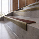 Antique Brass anti-slip stair nosing with chestnut CarbiGrip insert fitted to concrete steps