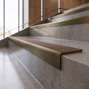 Antique Brass anti-slip stair nosing with hazelnut CarbiGrip insert fitted to concrete steps